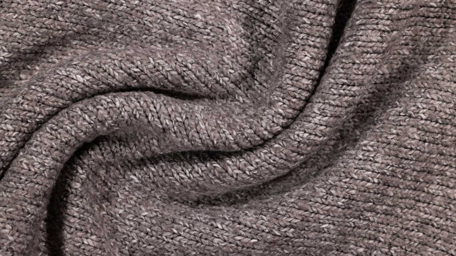 Close da textura de uma malha cinza fina